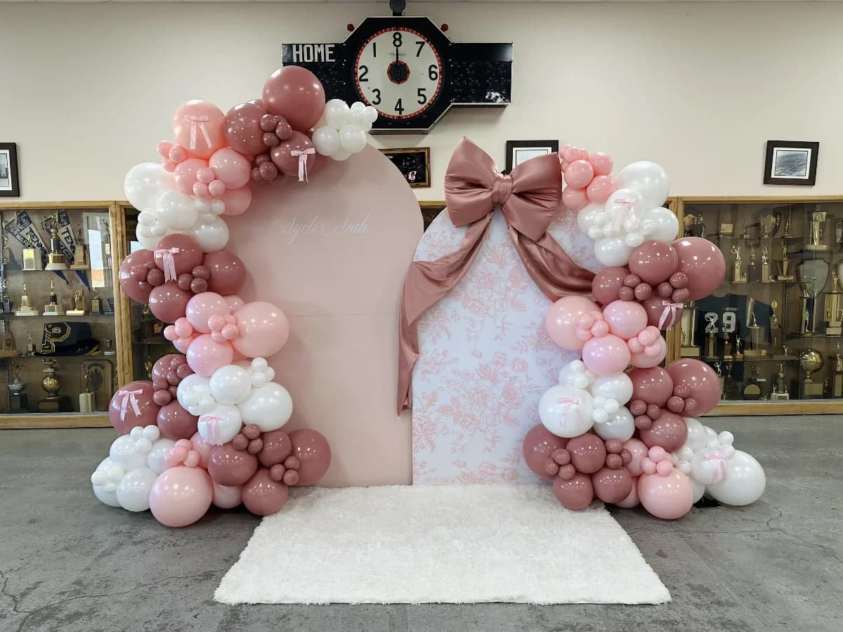 2 Arch w/ Balloon garland, Custom sign, & Large prop
